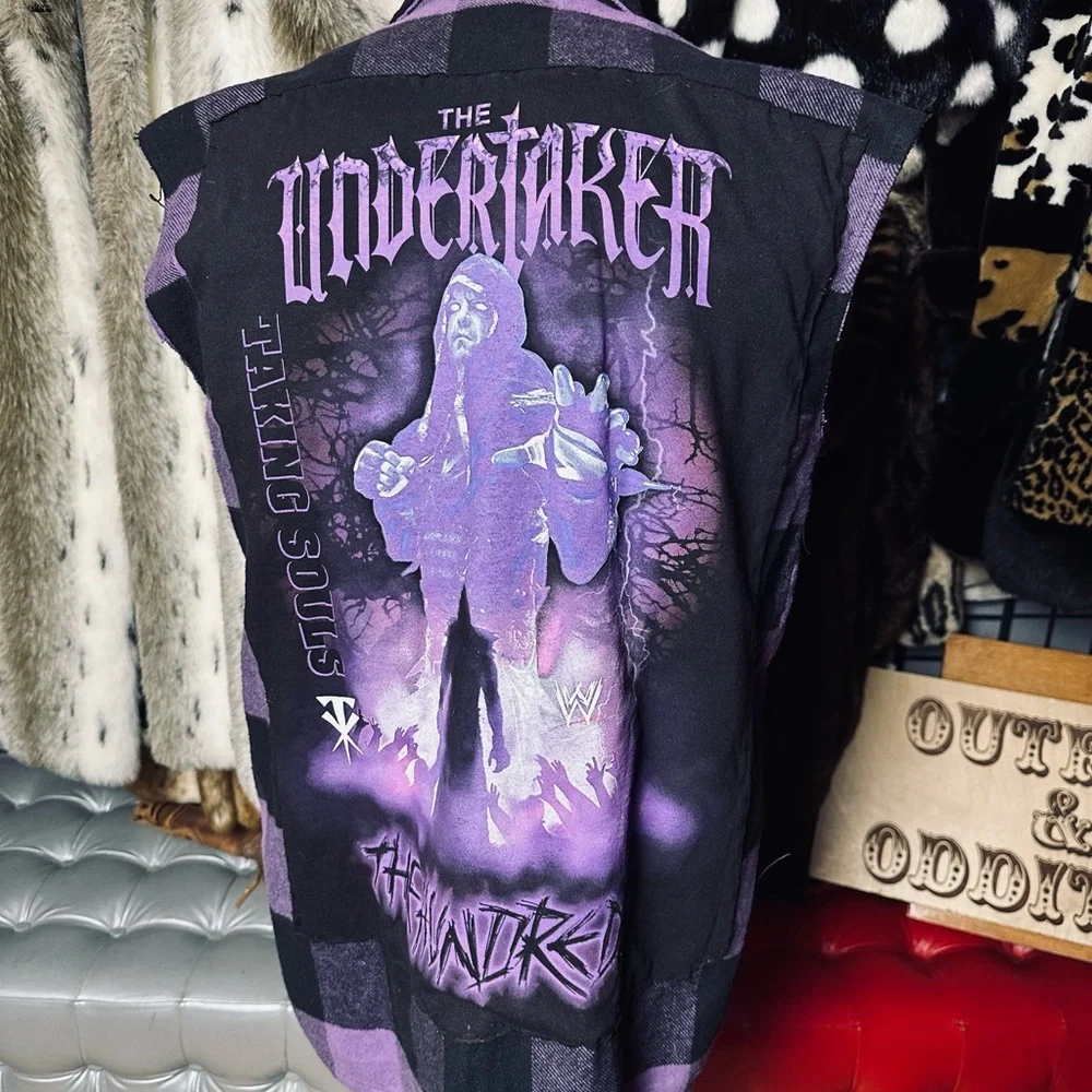 “The Undertaker” huge patch on a Rothco plaid sleeveless shirt
